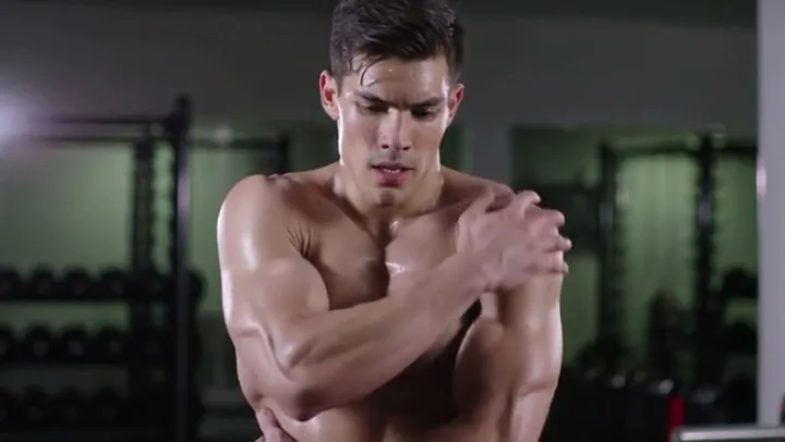 Man holding his shoulder after training